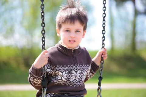 Small child on swing Stock Photos