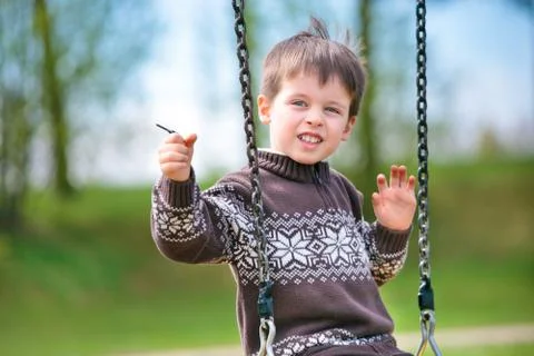 Small child on swing Stock Photos