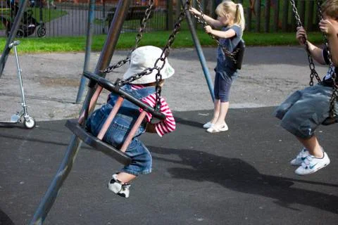 Small child on a swing. Stock Photos