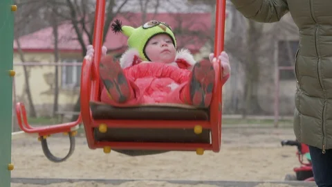 A small child swings on a swing Stock-Footage 87040319