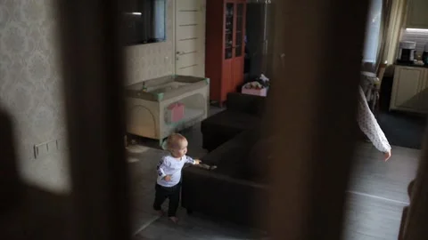 A small child takes the first steps Stock Footage 131643054