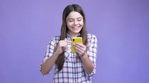 Small child use app gadget chatting isolated bright color background Stock Footage 190880677