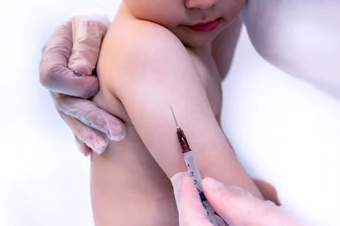 Small child vaccination process Stock Photos