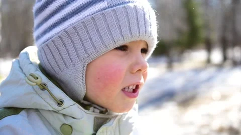 A small child walks in the Park. Close-up face. Fun and games in the fresh air. Video stock 88539713