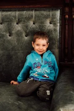 A small child without front teeth laughs merrily Stock Photos