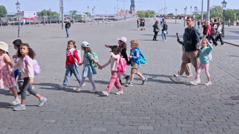 Small children in bright clothes exploring Stock Footage 327972877