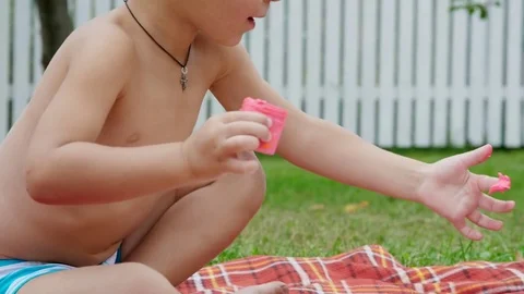 Small children, a four-year-old boy and a one-year-old girl, brother and sister Stock Footage 80440406