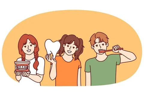 Small children with toothbrush and model of large tooth are urged to follo... Stock Photos