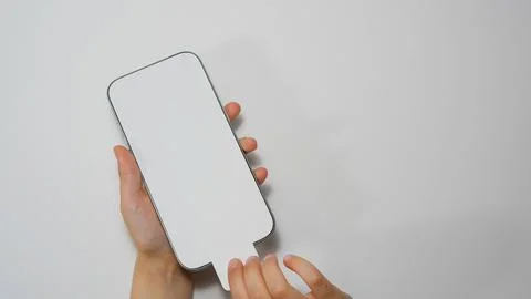 Small children's hands remove protective film from the latest iphone 15. Russia Stock Photos