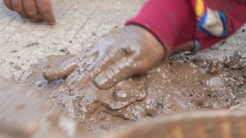 Small Childs hands playing with sand and mud. child playing outdoors with mud Stock Footage 312097540