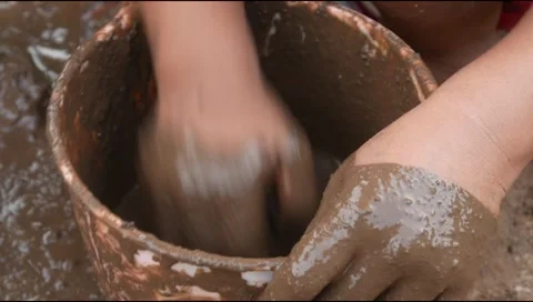 Small Childs hands playing with sand and mud. child playing outdoors with mud Stock Footage 312097571