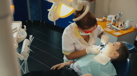 Small child's visit to the dentist Stock Footage 54682617