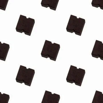 Small chocolate bar on a light background. seamless pattern. Background image Stock Photos