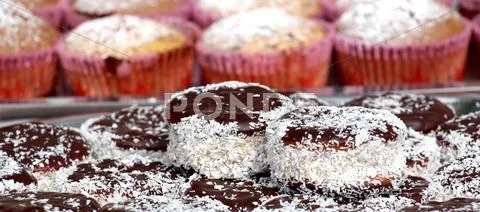 Small chocolate cakes with coconut Stock Photos