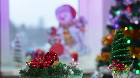 A small Christmas tree and a rotating stand with decorations Stock Footage 256222406