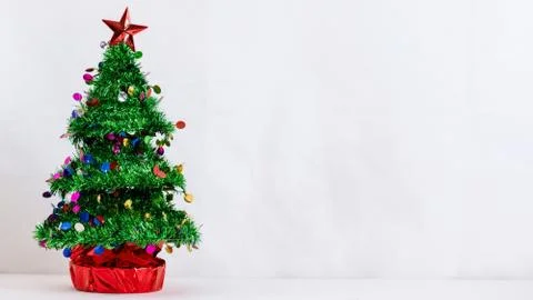 Small Christmas Tree on White Table Stock Photos