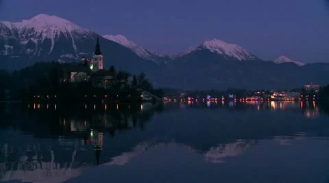 A small church on an island at dawn at Lake Bled, Slovenia. Stock Footage