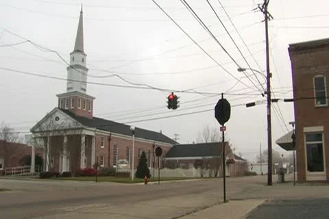 Small Church with Traffic Light in the foreground 스톡 동영상 10764962