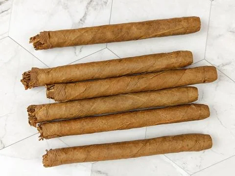 Small cigars, close-up, on a table Stock Photos