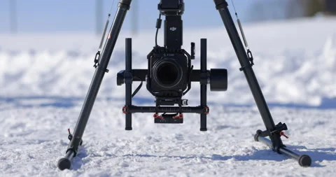 Small cinema camera mounted onto a drone gimbal in winter - close up Stock Footage 148222531