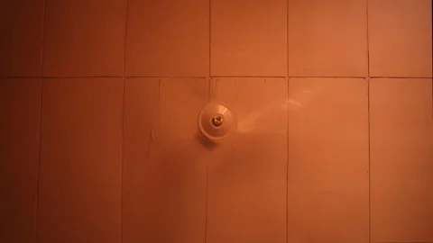 Small Circular Fan Fixture Mounted Against Orange Tiles Stock Footage 346470665