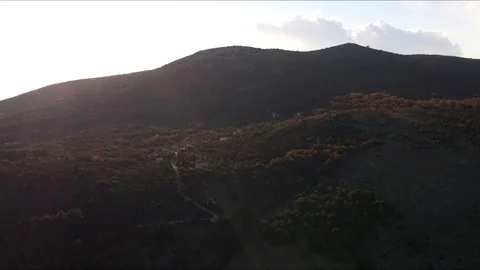 Small city on a hill in sunset Stock Footage 100128292
