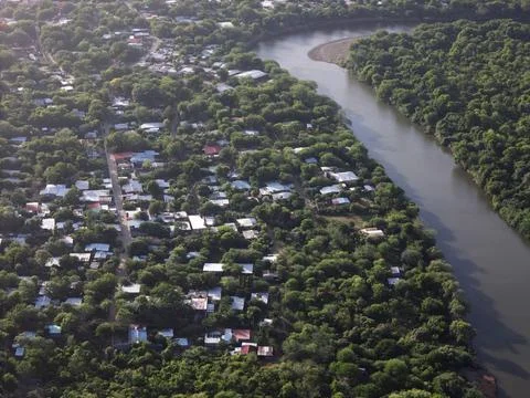 Small city on river flow Stock Photos