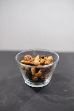 Small class of fresh nuts above black surface Stock Photos