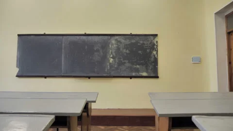 Small Class Room With Old Grey Tables And Blackboard Stock Footage 139616166