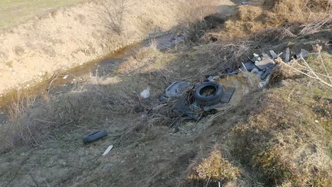 Small clean creek polluted with trash, Stock Footage 105629916