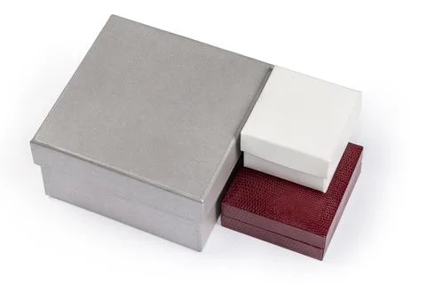 Small closed square cardboard boxes different sizes and colors Stockfoto's