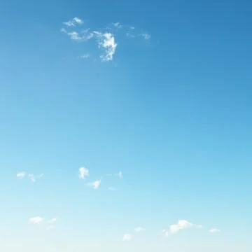 Small clouds on blue sky Stock Photos