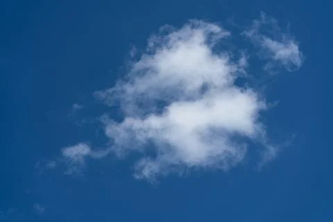 Small clouds on blue sky Stock Photos