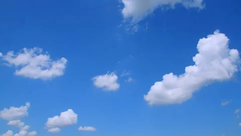 Small clouds in a blue sky on a spring day. 4k60p Stock Footage 132219621