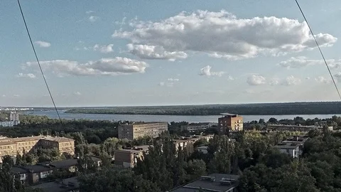 Small clouds float smoothly over the river and the city, timelapse Stock Footage 112718629