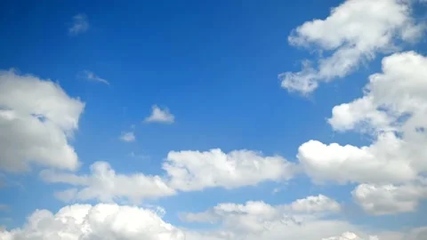 Small clouds forming in the blue sky, flying planes in the distance Stock Footage 162263651