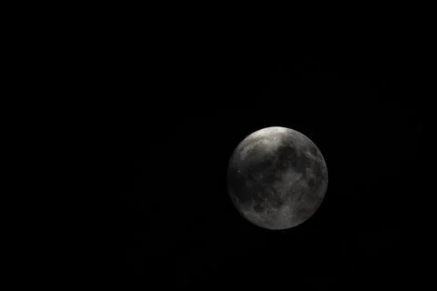 Small clouds obscured the full moon in the sky Stock Photos