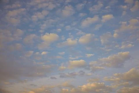 Small clouds repeat in blue sky Stock Photos