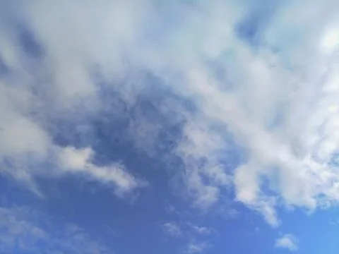 Small clouds on a sunny day Stock Photos