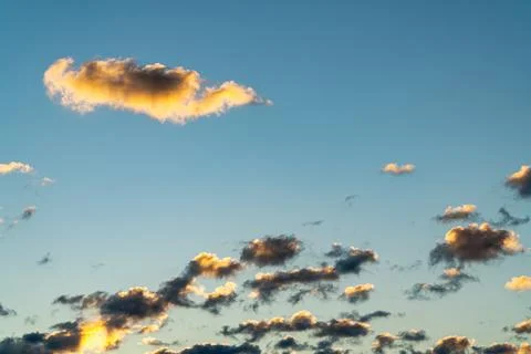 Small Clouds at Sunset Sky with Warm Light Stock-Fotos