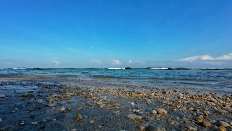 Small coastal rocks washed by ocean waves Stock Footage 321260110