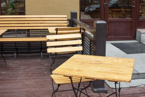 Small coffee in the centre tiny wooden tables and chairs Stock Photos
