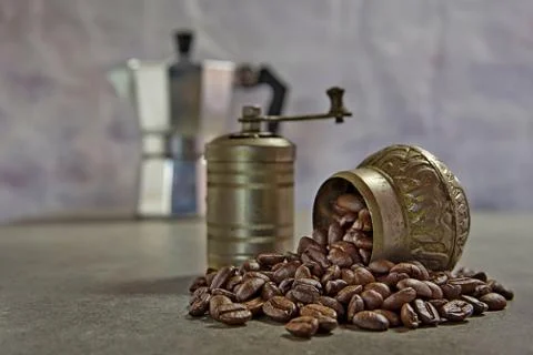 Small coffee grinder with roasted coffee beans Stock Photos