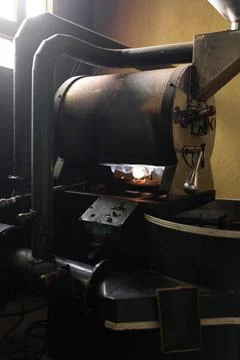 A small coffee roaster machine with the burner on Stock-Fotos
