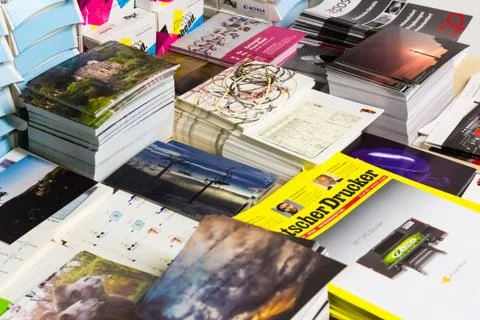 Small Collection of Assorted Print Products on Display Magazines Postcards Stock Photos