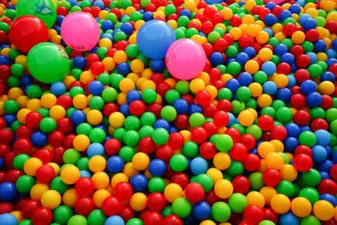 Small colored balls. Background with colored balls. Stock Photos