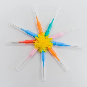 Small colored brushes for cleaning braces on teeth Stock Photos