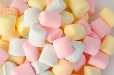 Small colored puffy marshmallows Stock Photos
