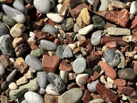 Small colourful pebbles on the beach Stock Photos