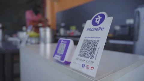 Small community cafe keeping UPI QR codes scanner and smart speaker for Stock Footage 239293422